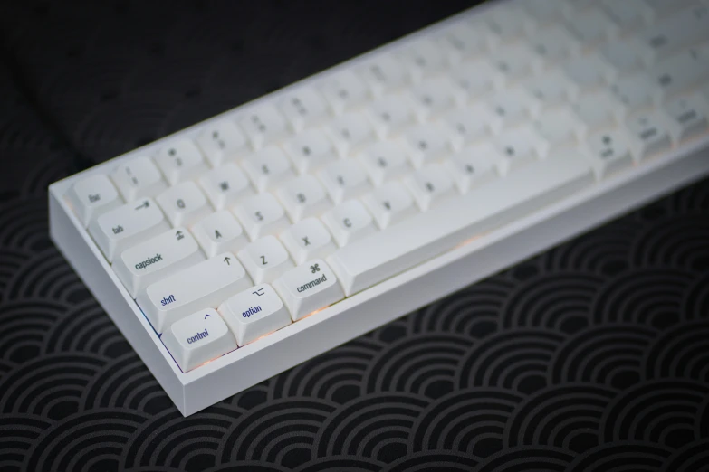 a white keyboard sitting on top of a table