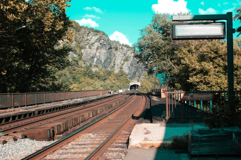 an empty railroad track and a train on it