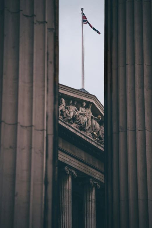 a building with columns is seen through the window