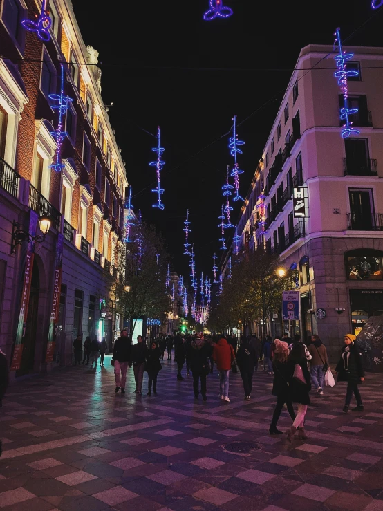 a view down the middle of a street at night