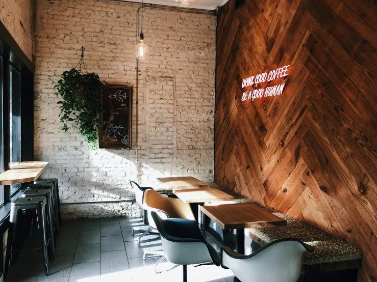 two desks and chairs are on the floor in a restaurant