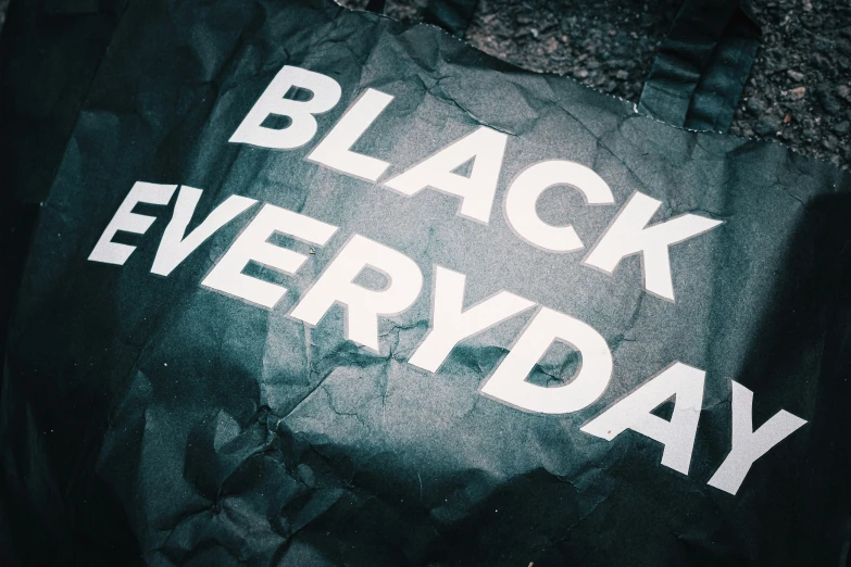 an umbrella that says black everyday on it