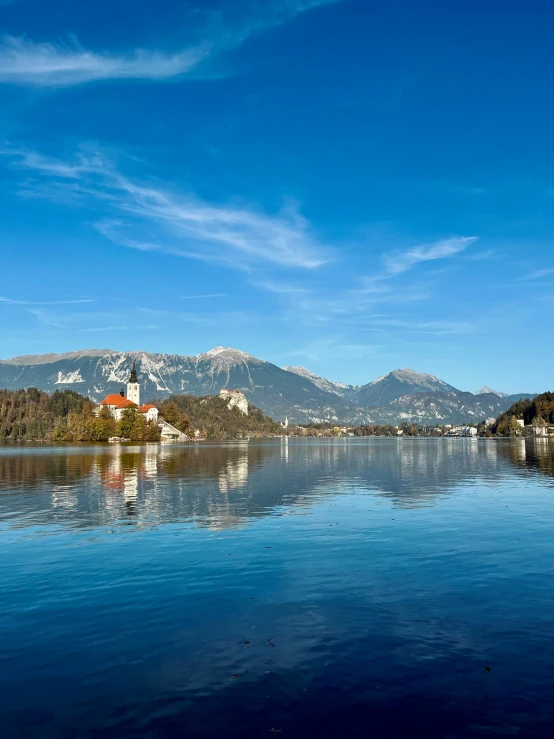 the sky is cloudy and blue with white clouds over a castle