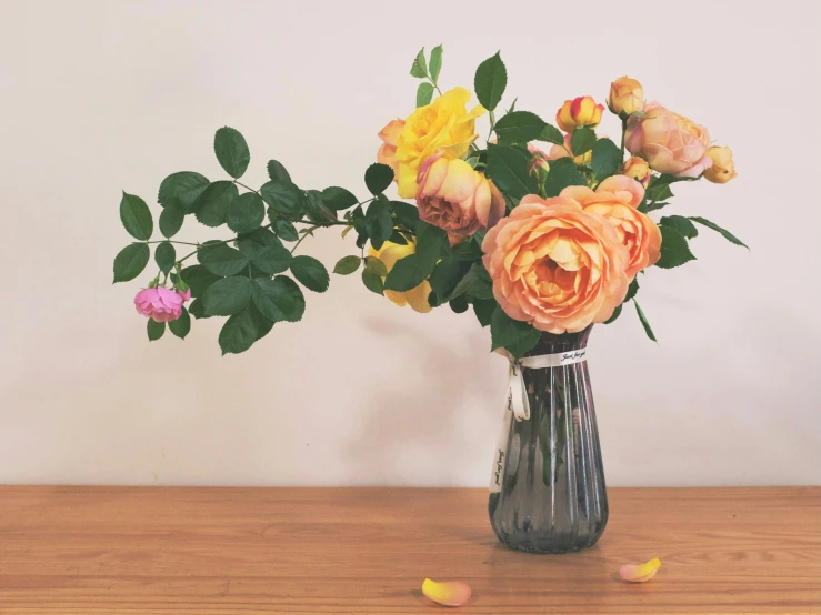 a vase full of flowers is shown on a table