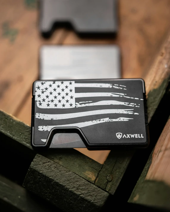 an american flag design on a black and silver card case