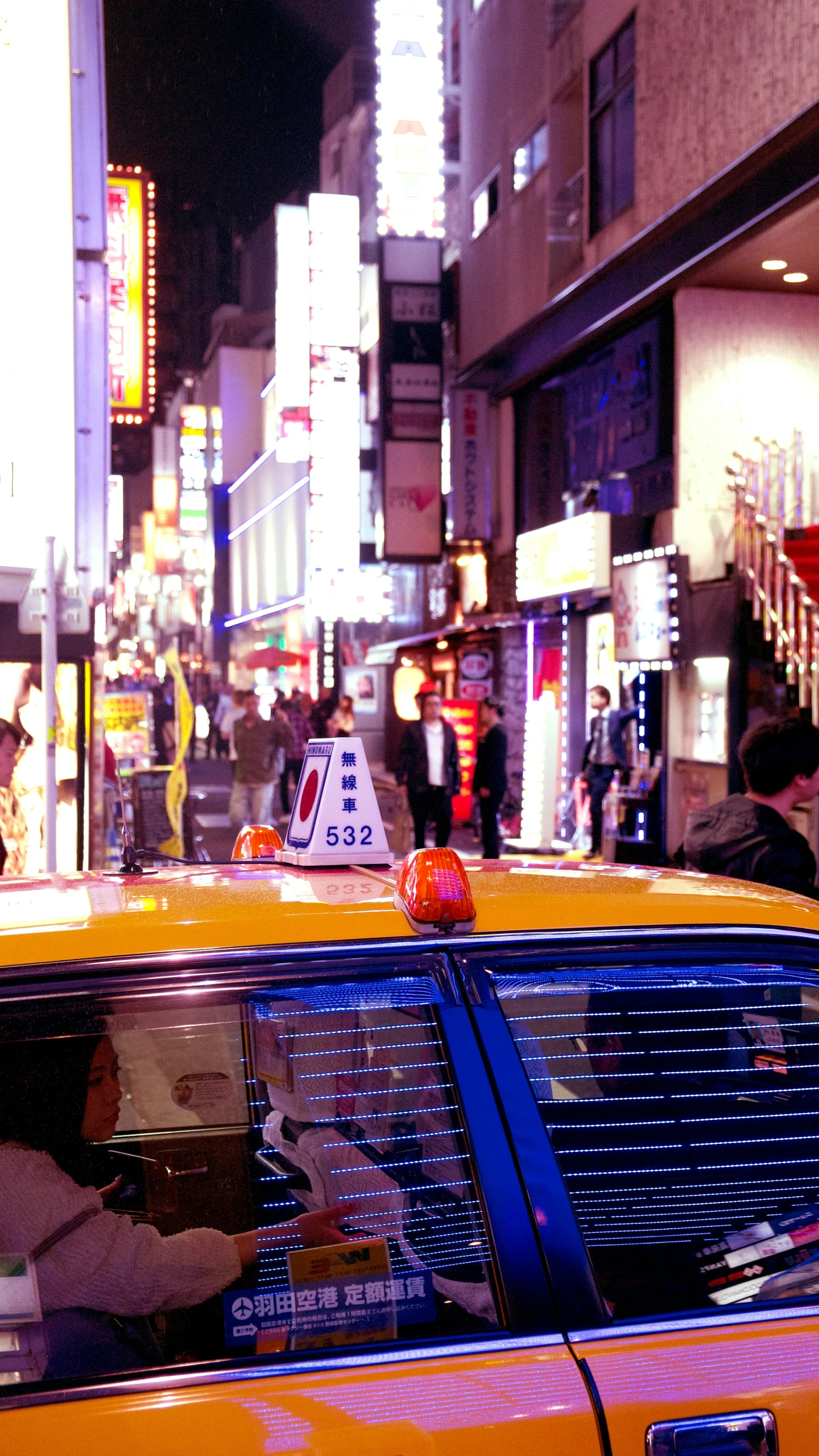 the cab is parked next to some buildings