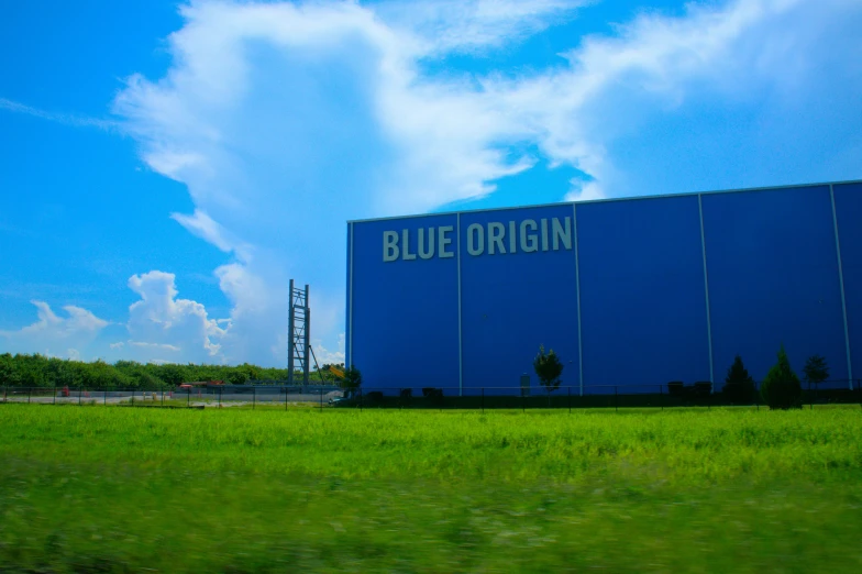 blue origin storage building on a grassy field