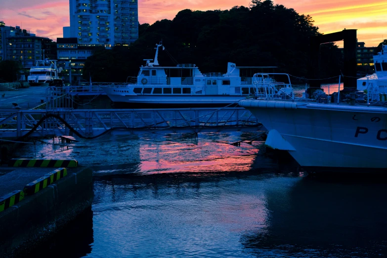 a few boats sitting out side in the water