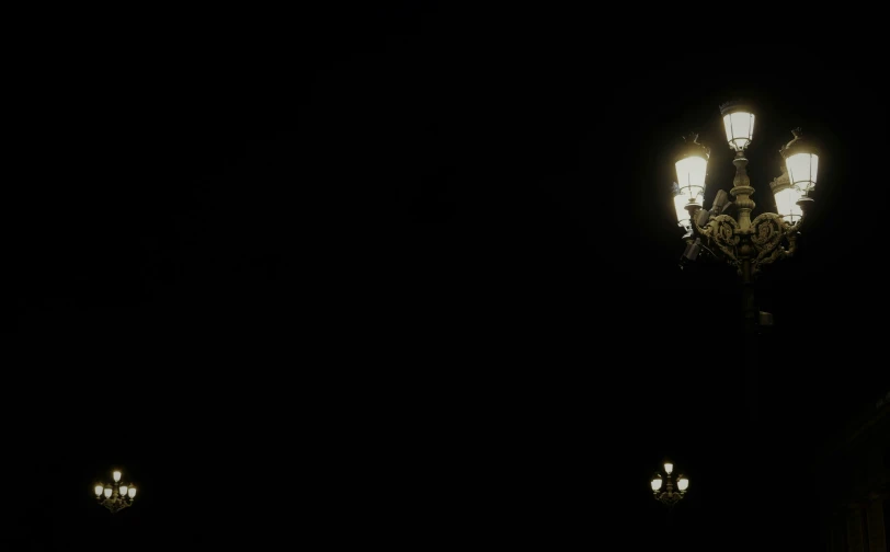 a street light with the lights turned on and dark