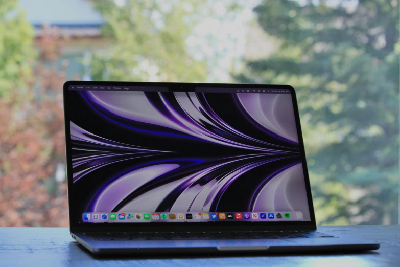 an open lap top computer sitting on a table