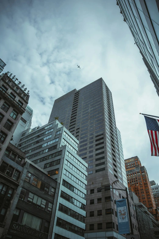 tall buildings in a city under the cloudy sky