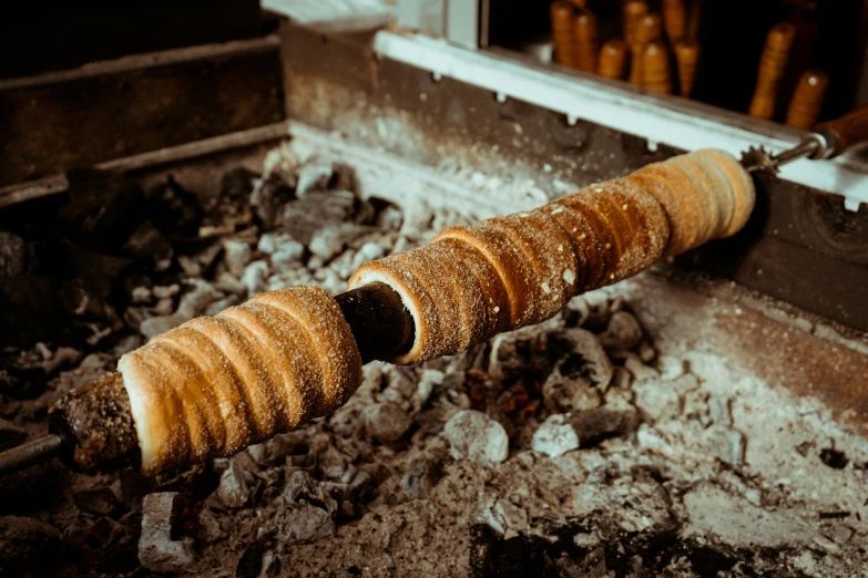 a metal pipe on top of a pile of rubble