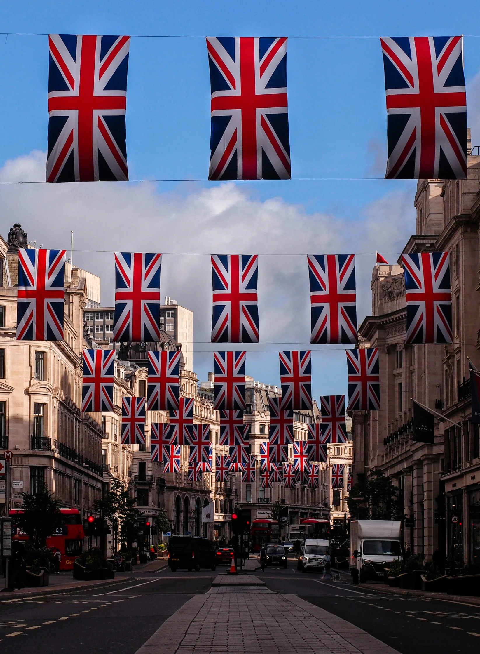 the british flag bunting on the street is flying high