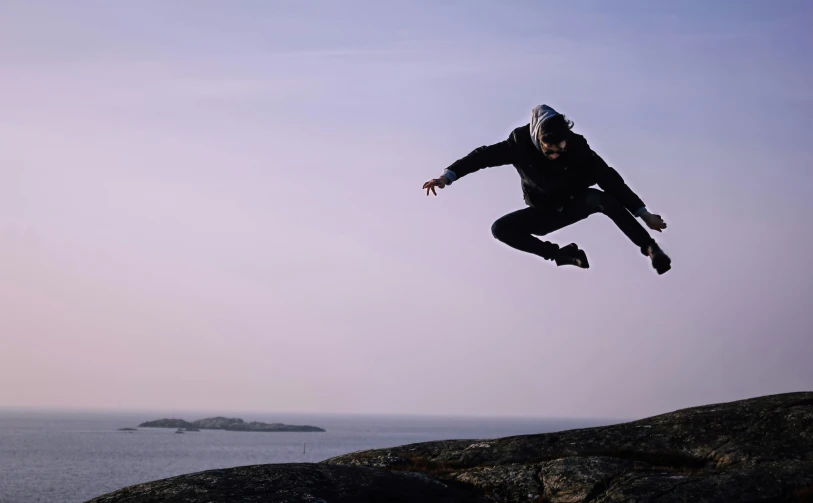 the man is performing a trick on the skateboard