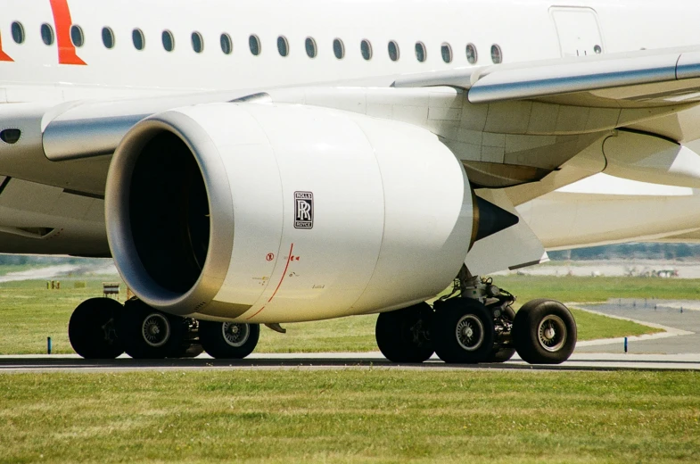 a large airplane with the engine and landing gear deployed