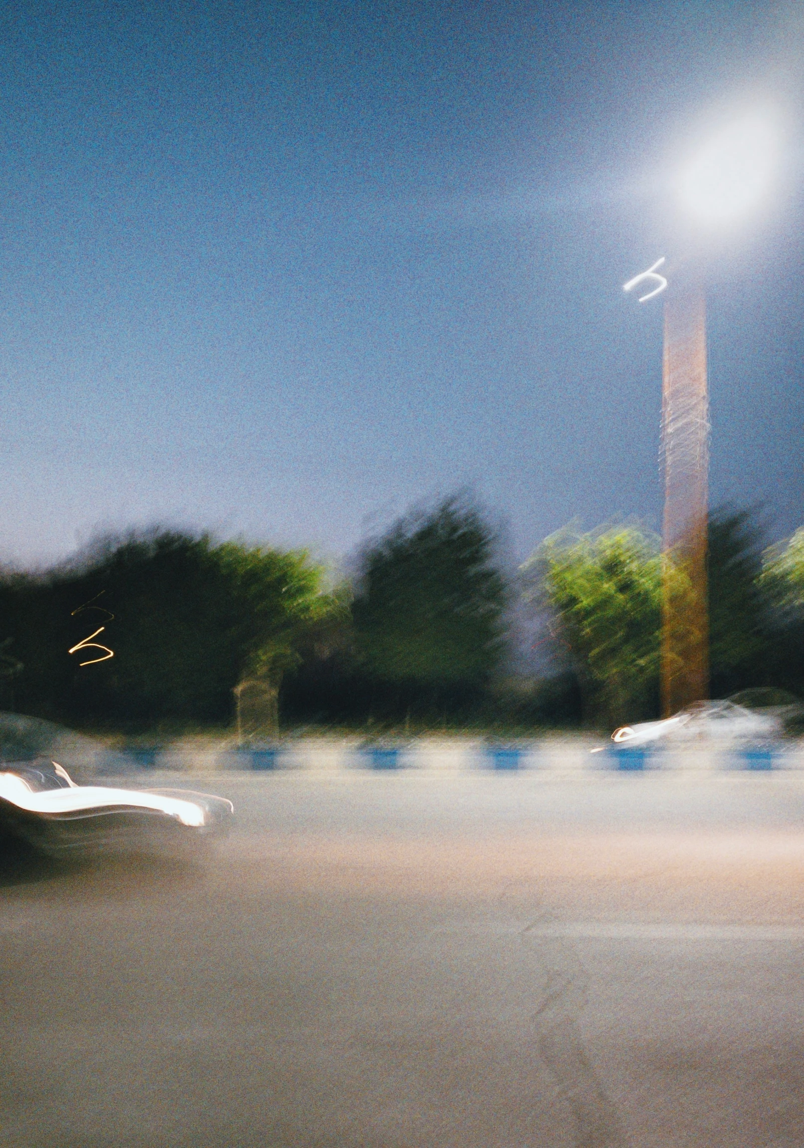 a blurry po of a parking lot at night