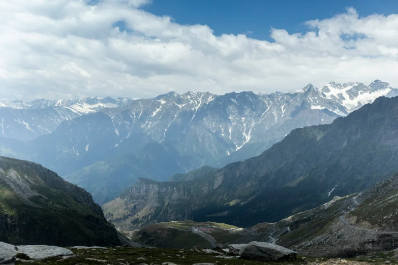 this is a mountain view, with rocks in the foreground