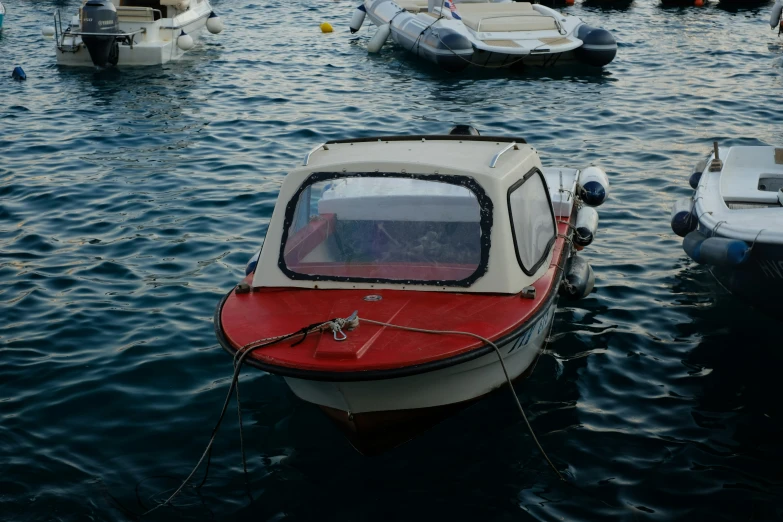 a group of boats are floating in a harbor