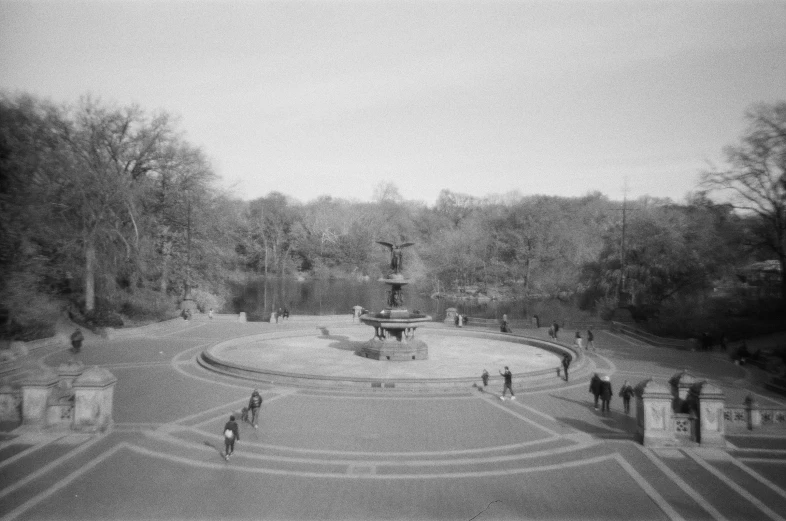 a large fountain in the middle of an open plaza