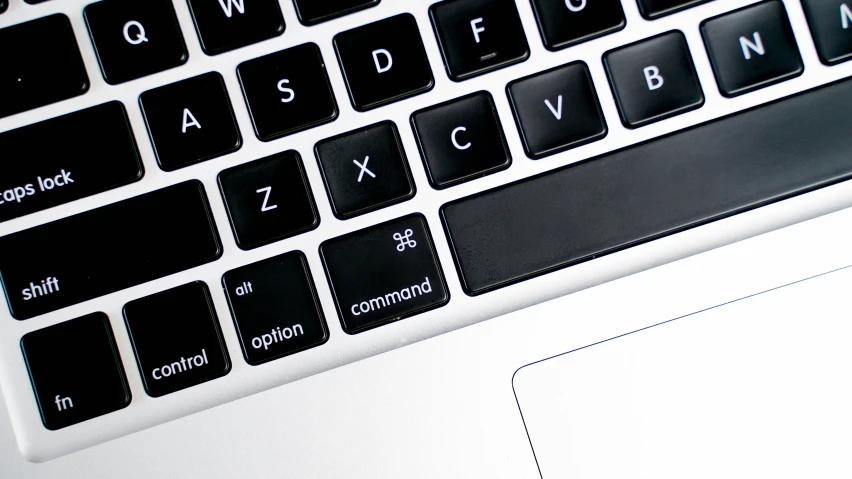 closeup of the black keys of an apple laptop