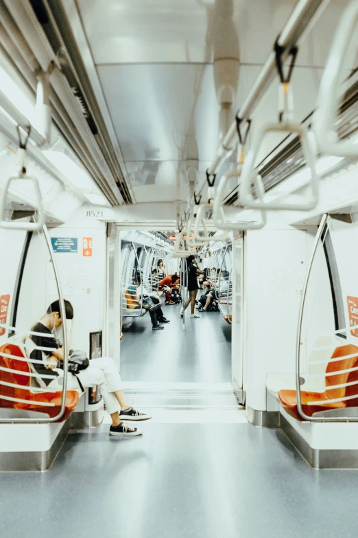 a train car filled with seats and some people