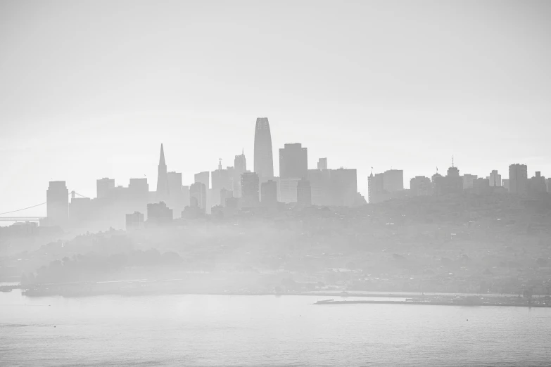 a big city with tall buildings sitting above a bay