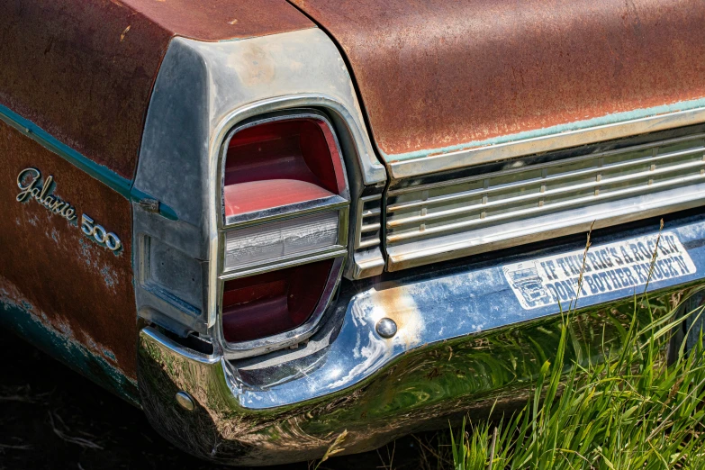 the front end of an old, rusted car