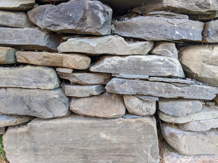 a stack of gray stones on the ground