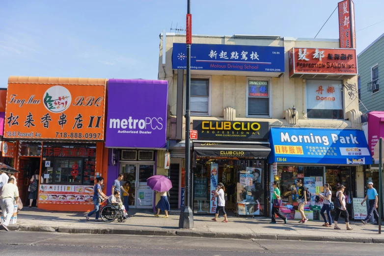 this is an asian shopping district with people out shopping