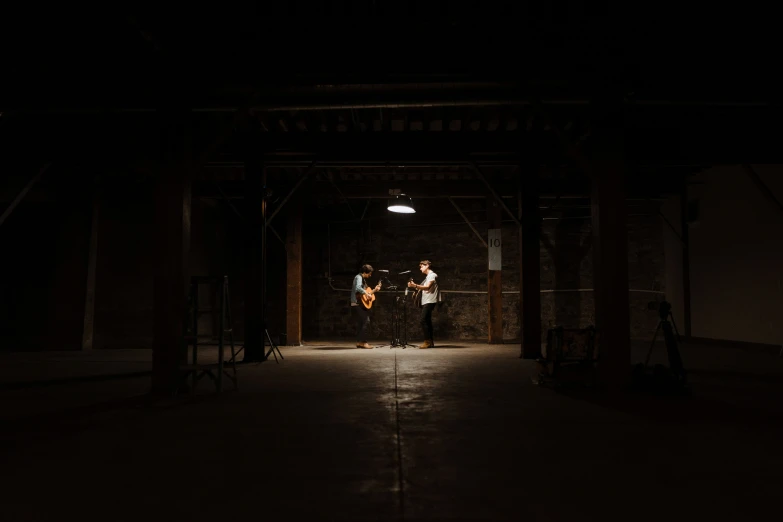 people standing on top of a dark covered building