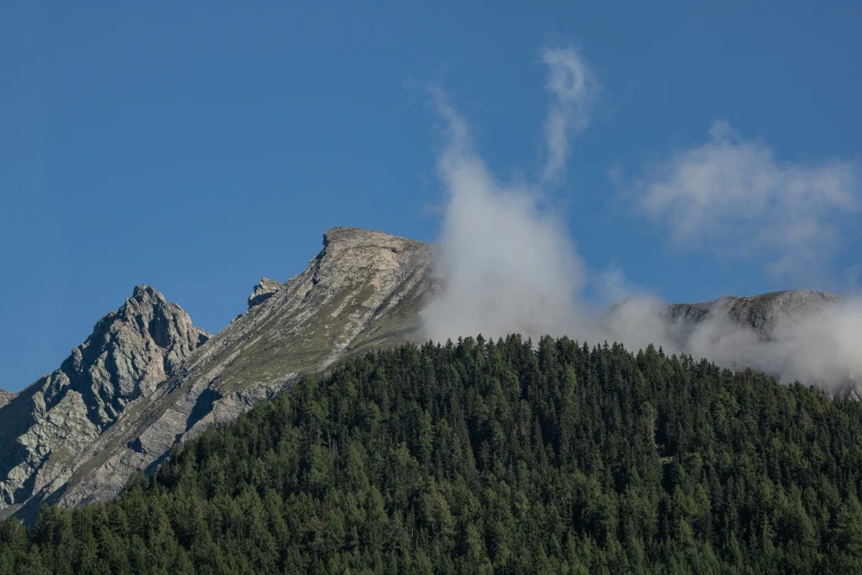 the mountains are covered in very thick clouds