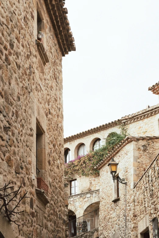 stone buildings lined up side by side with windows