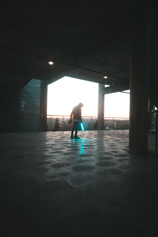 person with a bright neon blue frisbee walking away from a building