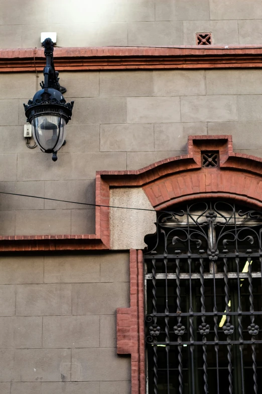 a lamp and some wires hanging from a wall