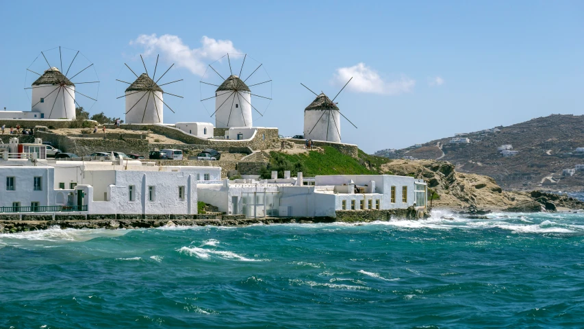 the houses are on a cliff above the water