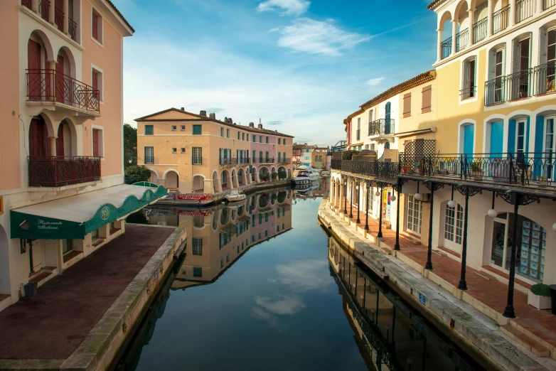 an image of a canal with buildings next to it