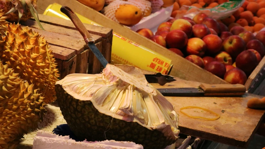 some different types of fruit displayed in a shop