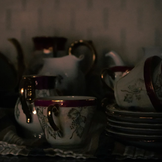 a shelf full of tea pots and other things