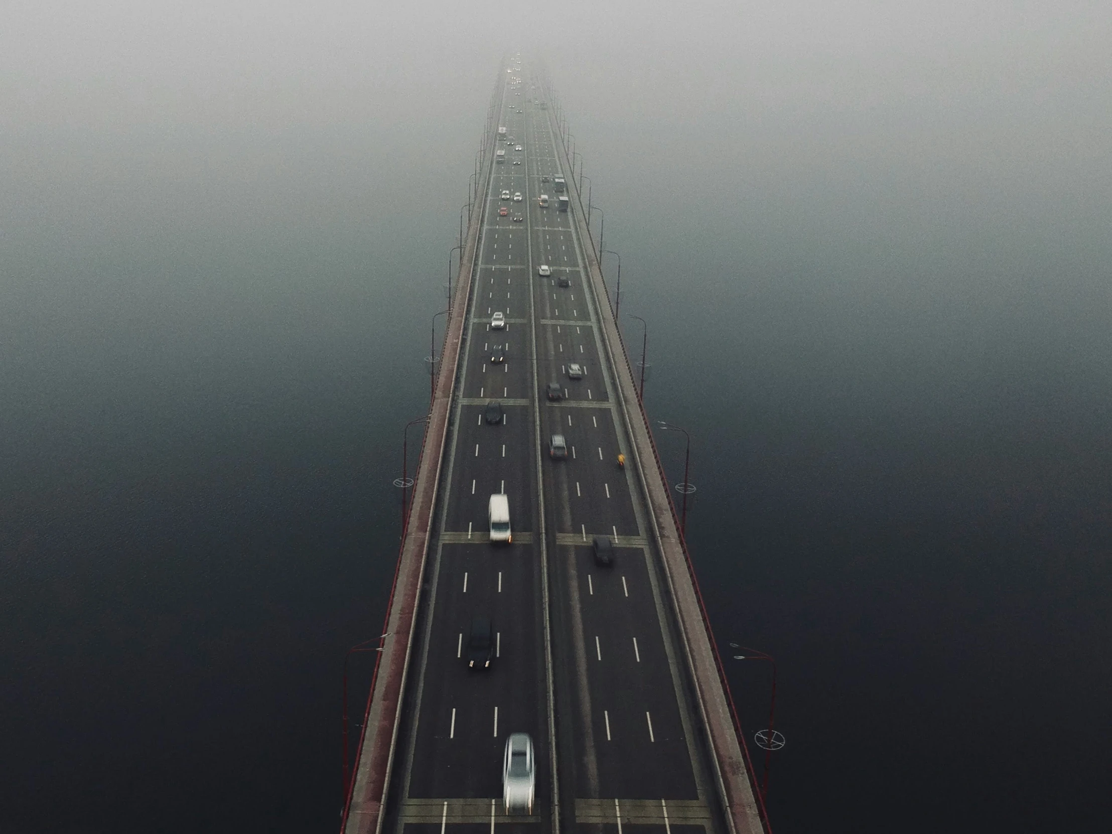 a view of the top of a bridge over water