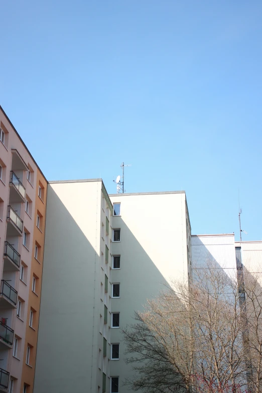 an apartment building next to a row of buildings