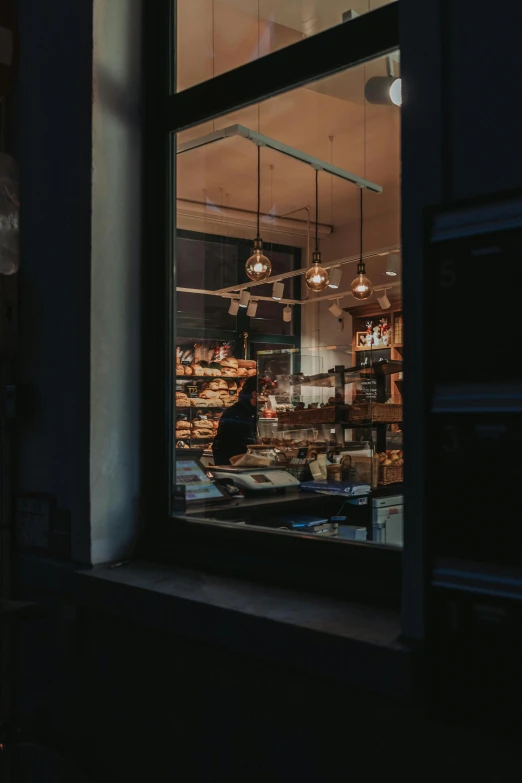 view from inside the building through a window to the food section