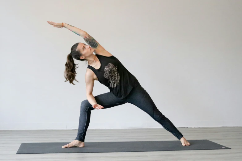 a woman stands on her legs in yoga yoga posture