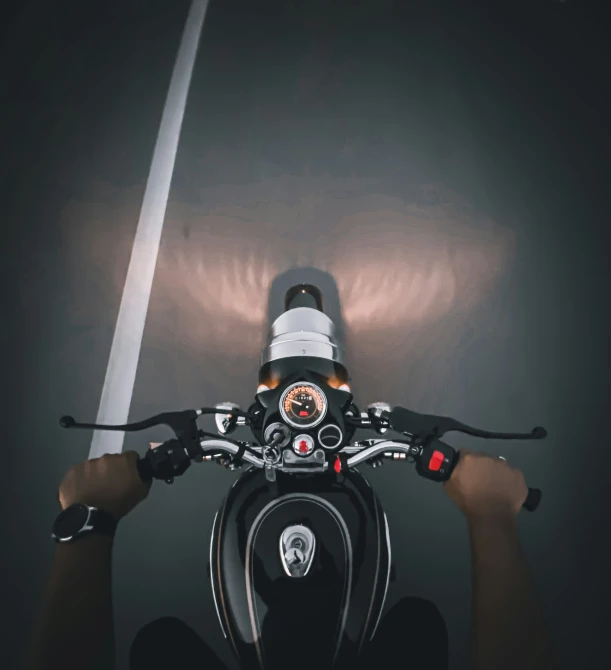 a close up of a motor bike parked in the street