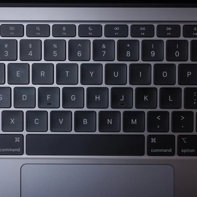 closeup of an open black keyboard in the dark