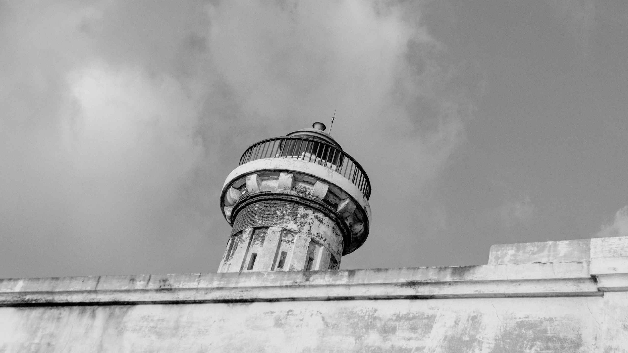 a black and white po of the top of a tall tower