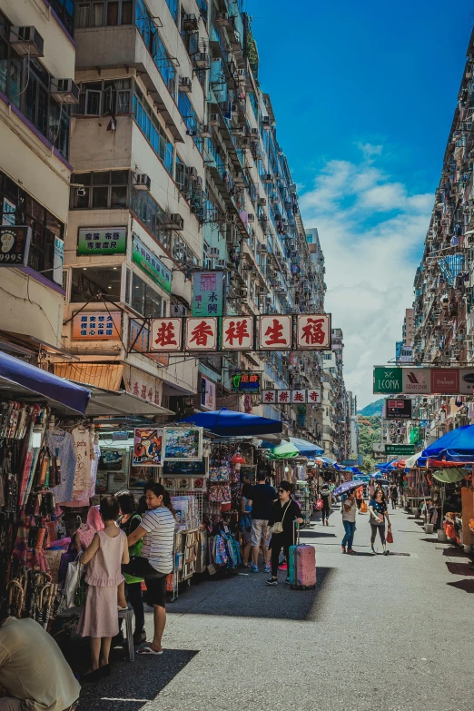 many people are shopping at this large market