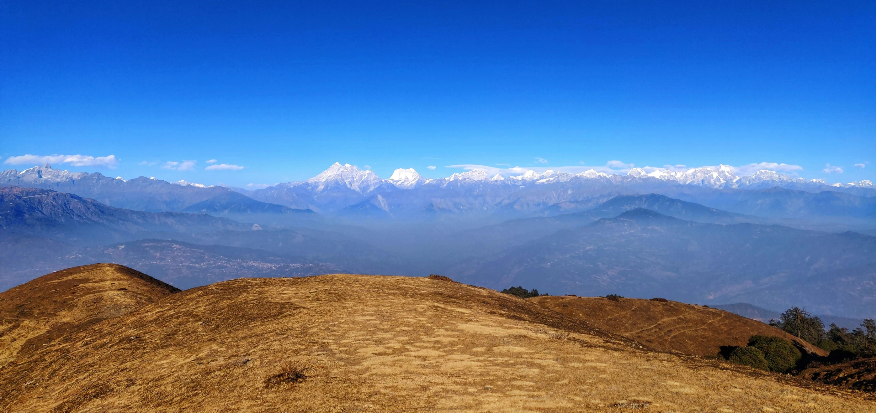 a view of mountains and valleys covered in dirt