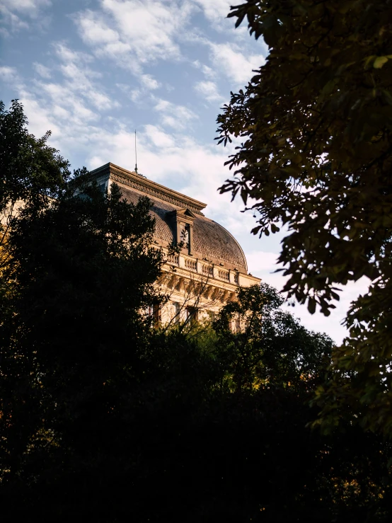 the top of a building is in view of some trees