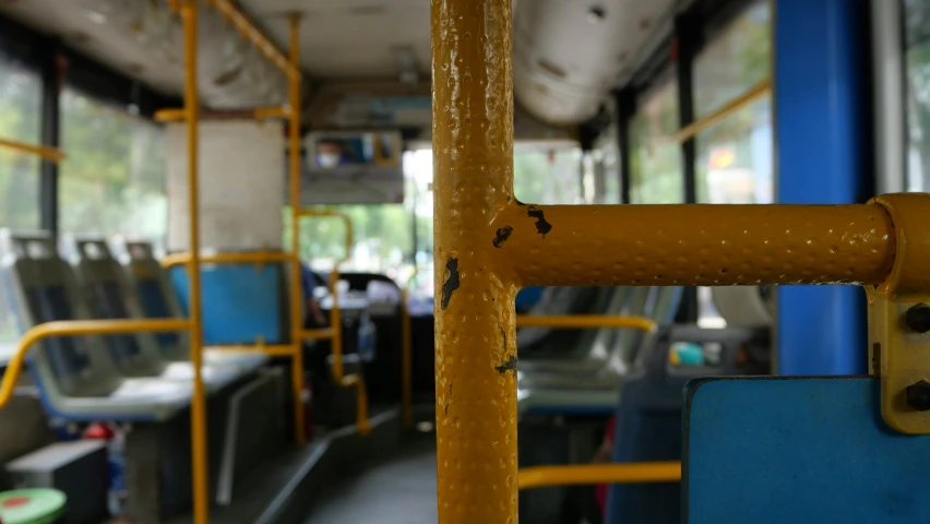 the inside view of a bus with a blue front seat