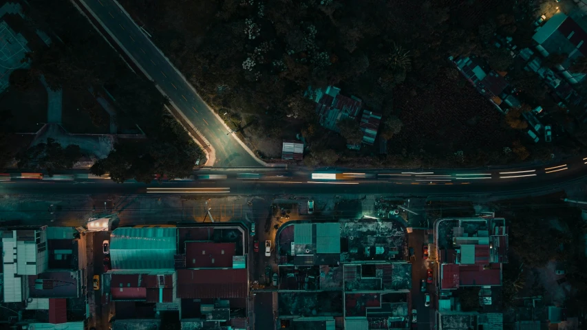 a city street at night seen from above